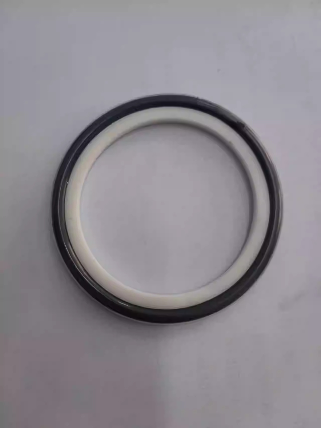 KFISO vacuum center support sealing ring is wrapped with PTFE O-ring for corrosion and high temperature resistance.